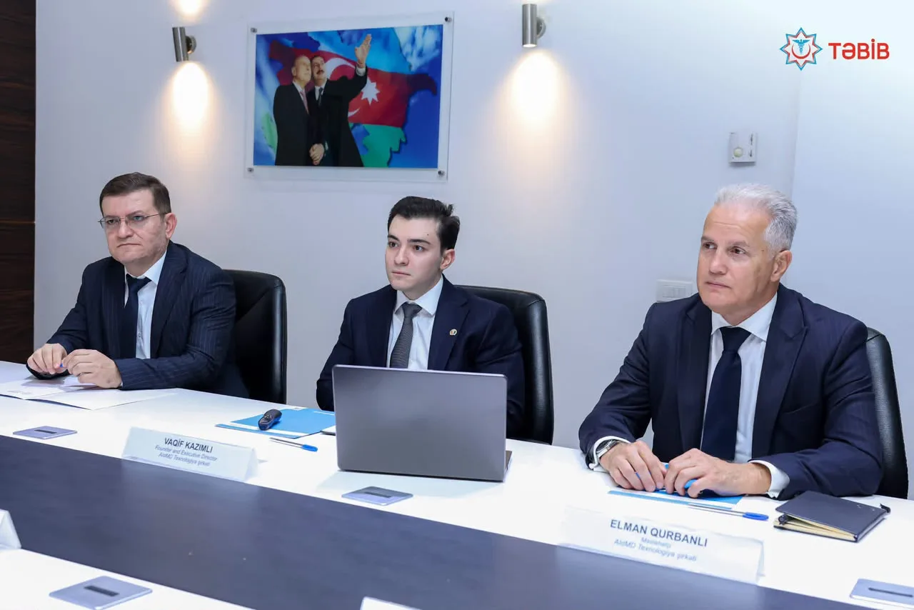 AIdMD founder and executive director Vagif Kazimli with advisor Elman Qurbanov at the meeting table.