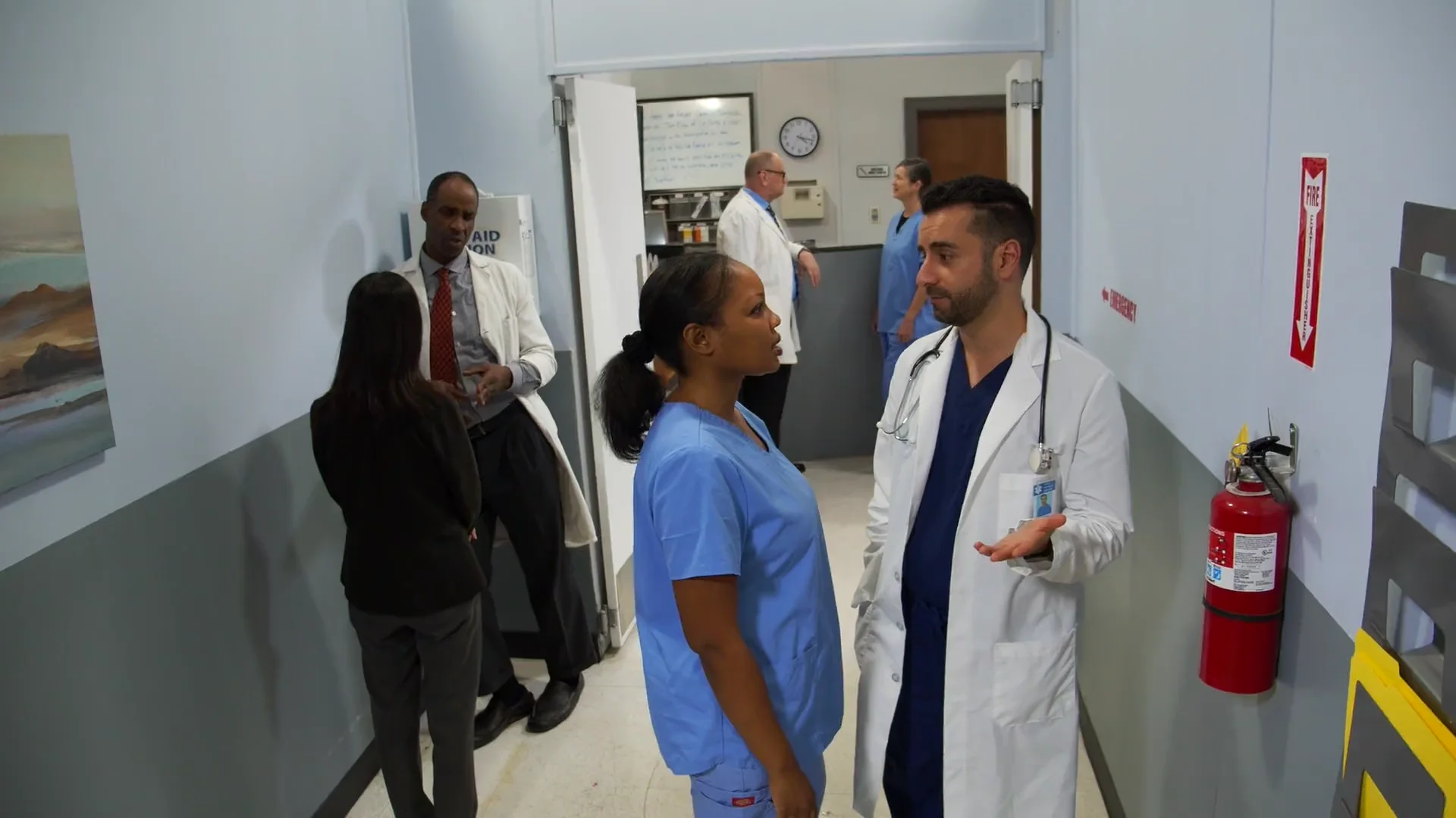 Clinicians caring for patients and working together in a clinic